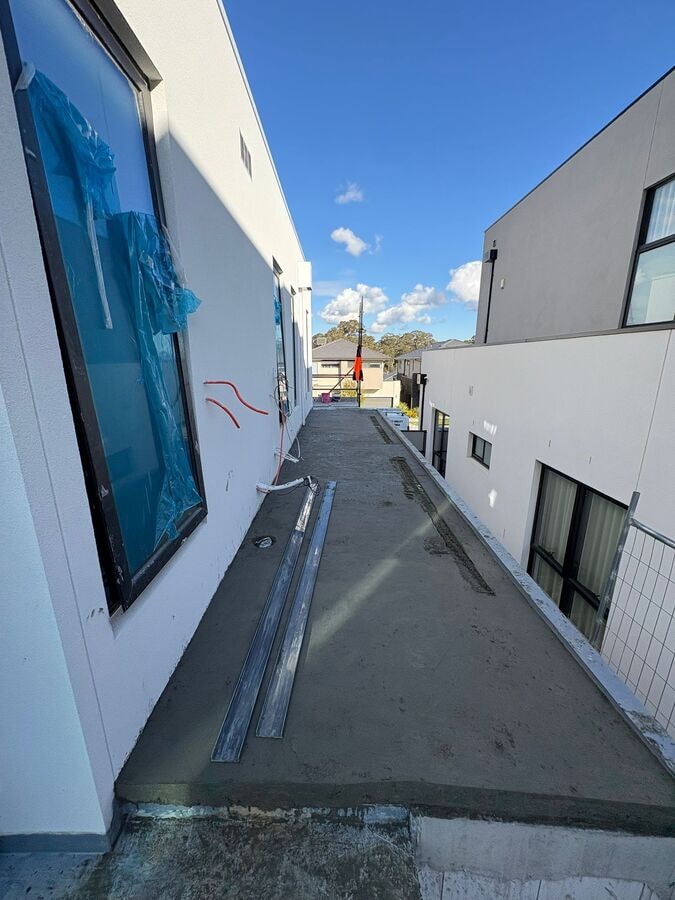 Balcony screed complete with linear drain channel in position — Narre Warren South by Casey Quality Coatings